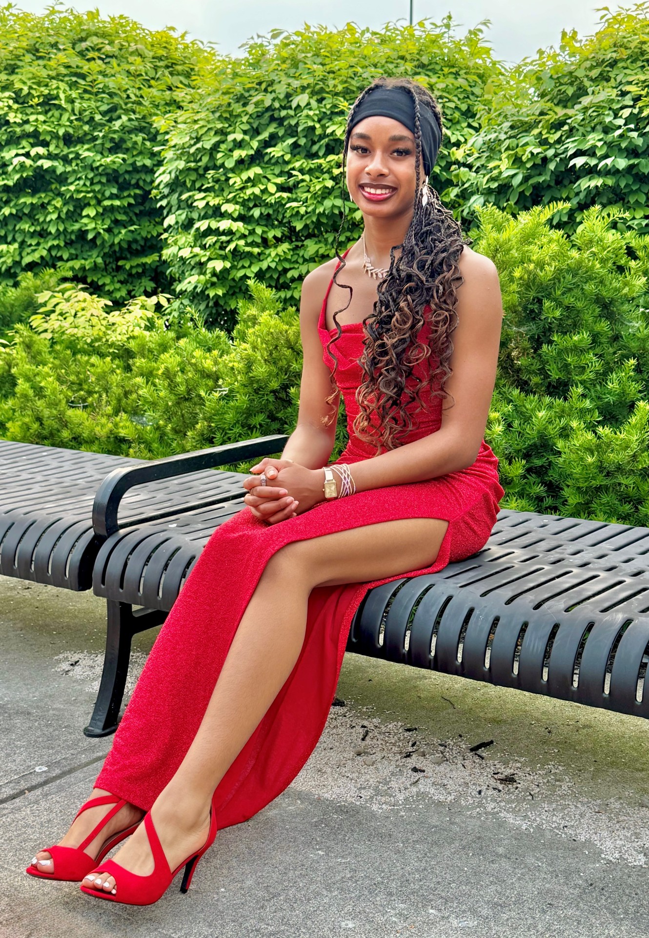Smiling teen girl in red formal dress